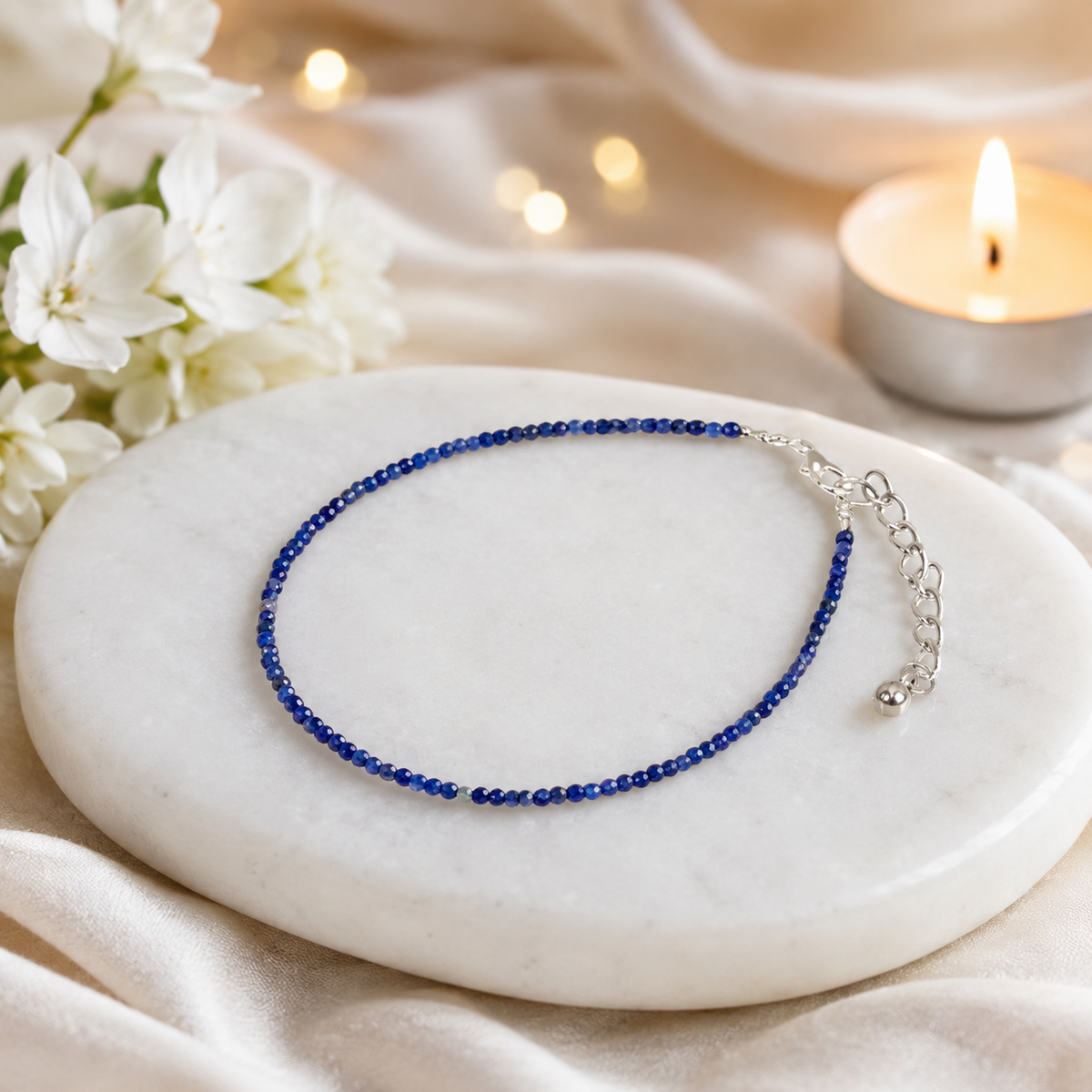 Lapis Lazuli Anklet on white marble with candle background