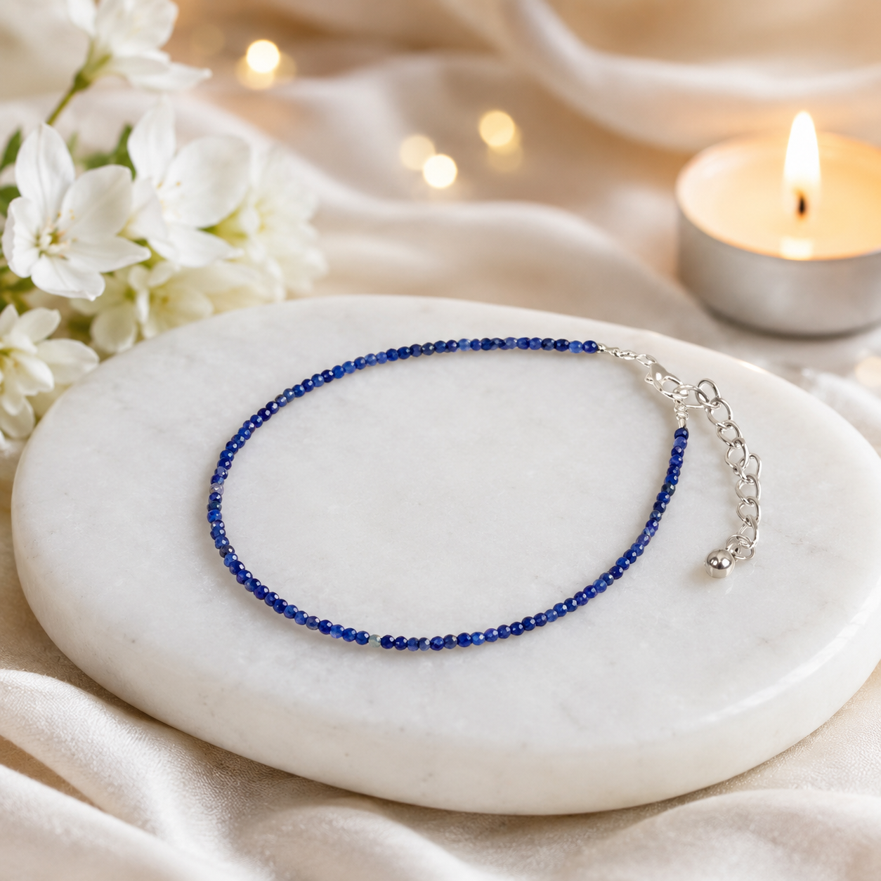 Lapis Lazuli Anklet on white marble with candle background
