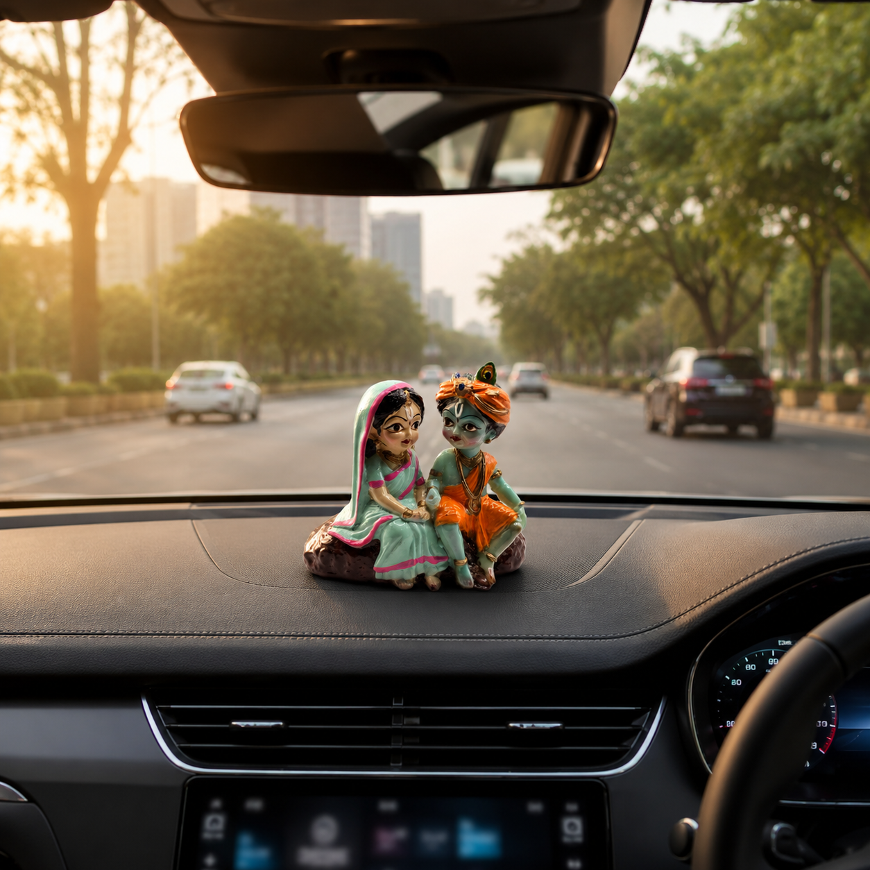 Radha Krishna Blessing Murti placed on car dashboard