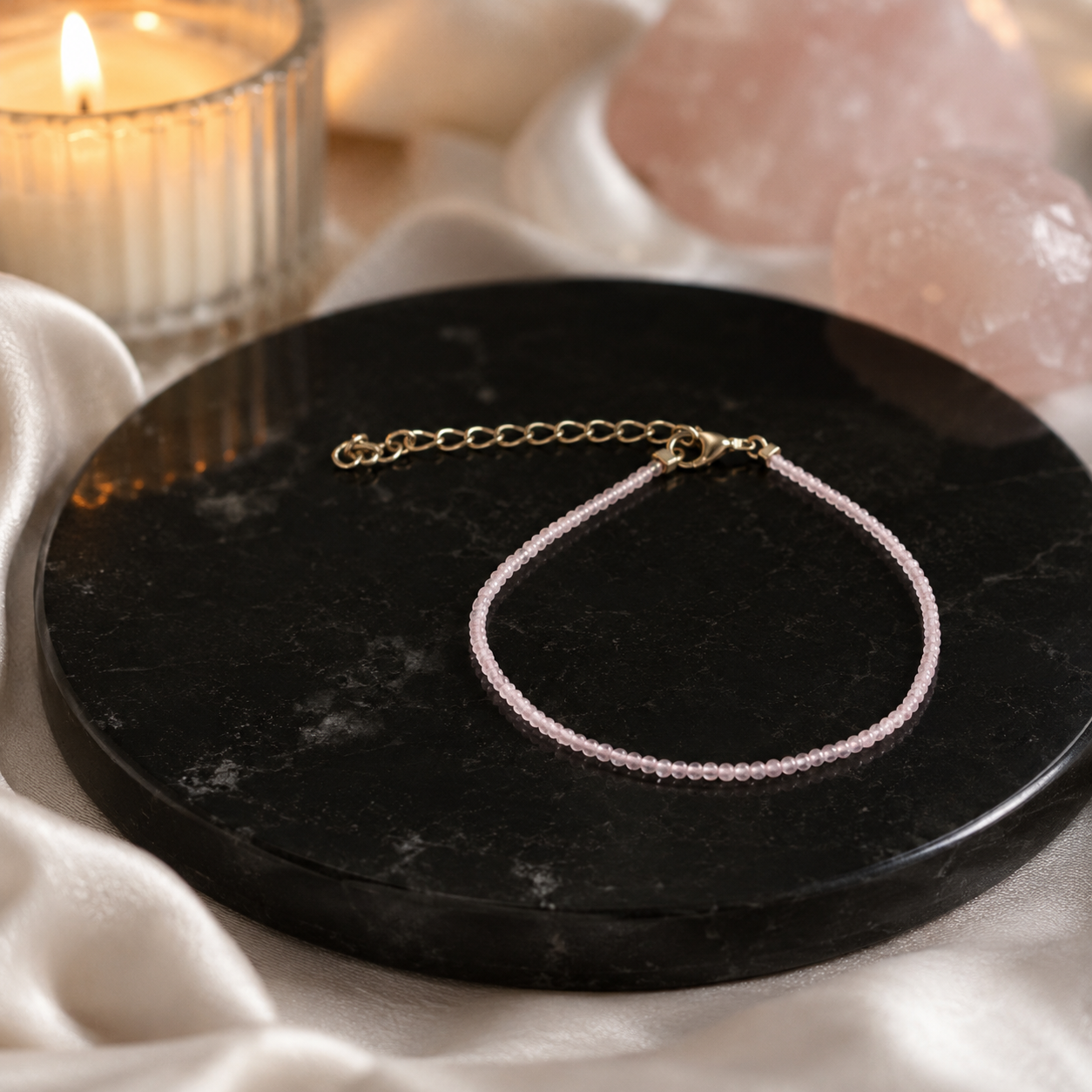 Rudvya Rose Quartz Anklet product photo on black stone display