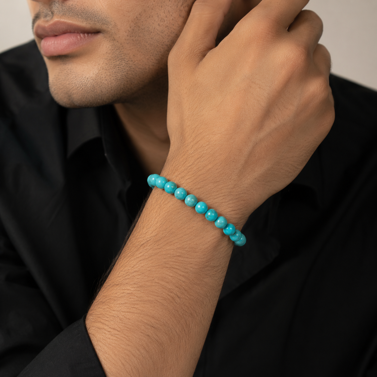 Rudvya Turquoise Bracelet worn on wrist with black shirt styling